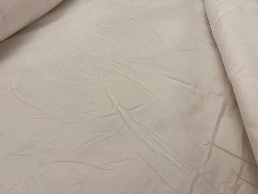 Wrinkled bed sheets, TWA Hotel JFK